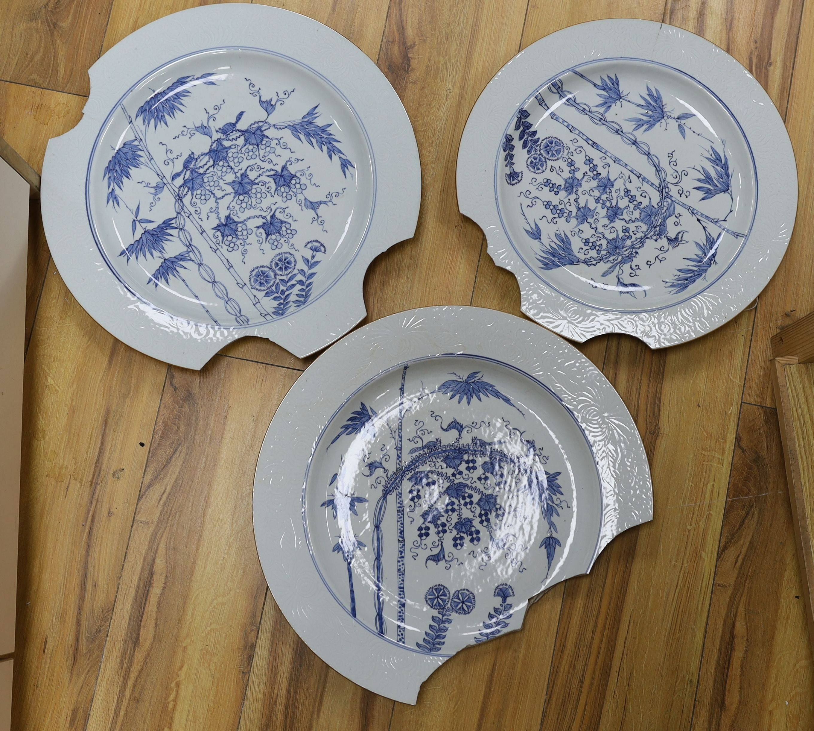 A group of three 18th century Chinese blue and white ‘squirrel, bamboo and vine’ chargers (a.f) 42cm